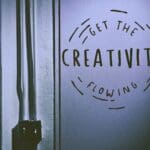 A door with the words " get the creativity flowing ".